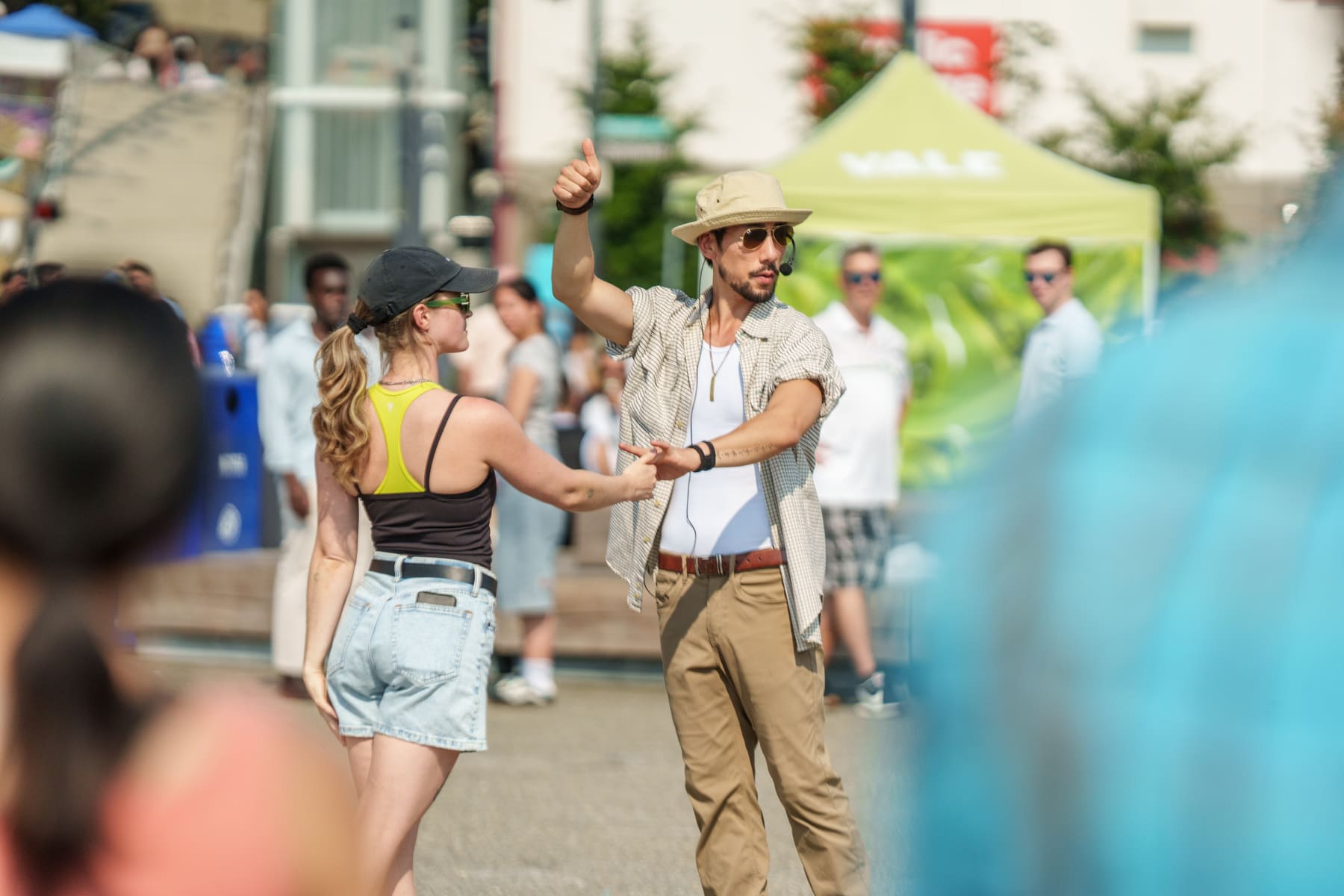 Janū teaching a Hustle move with a student at the Pier